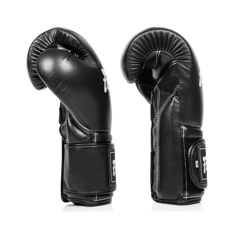 Pair of black Fairtex boxing gloves on a white background