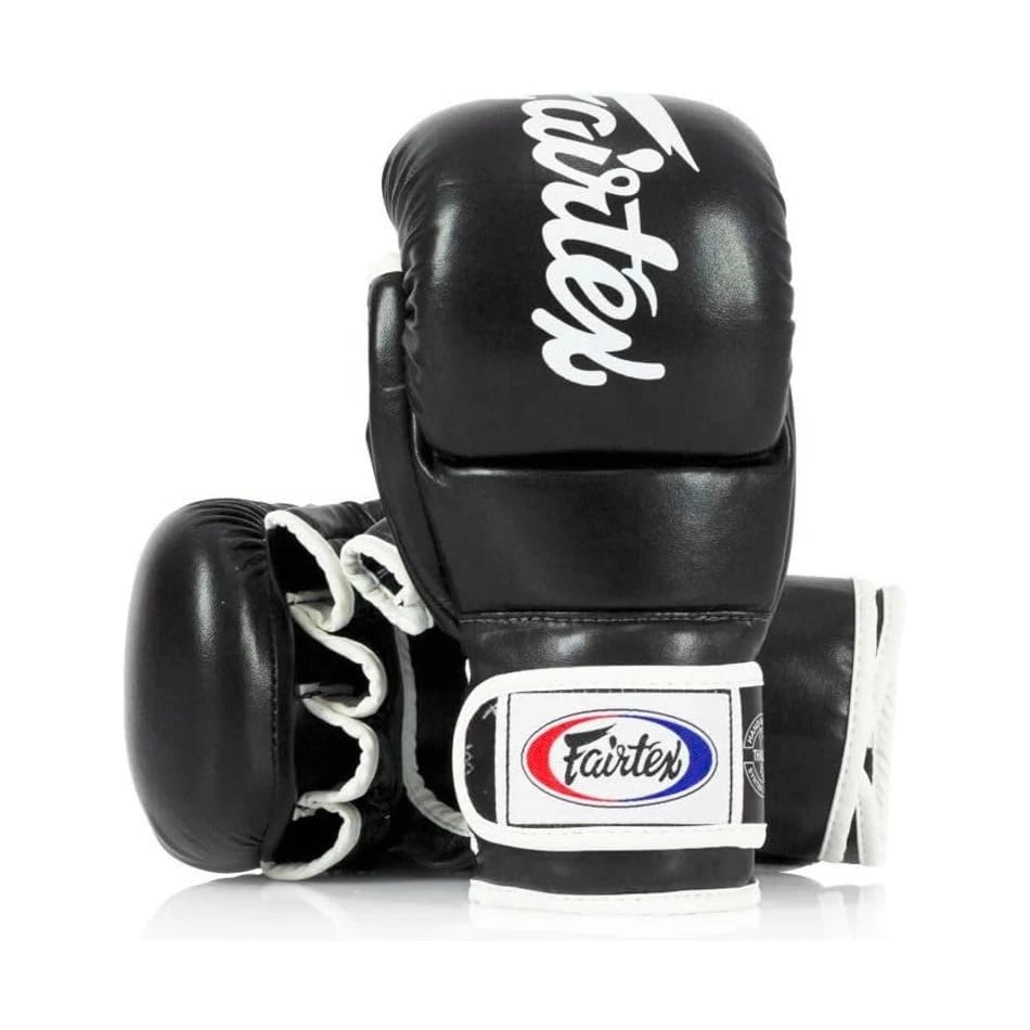 Black MMA sparring gloves with Fairtex branding on a white background