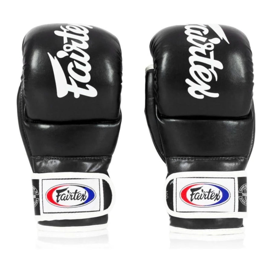 Pair of black MMA sparring gloves with Fairtex branding on a white background