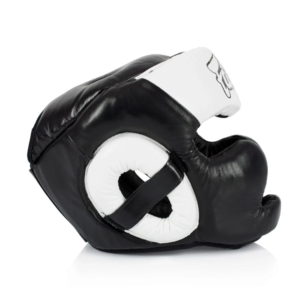 Side profile of a black boxing headgear with white accents on a white background