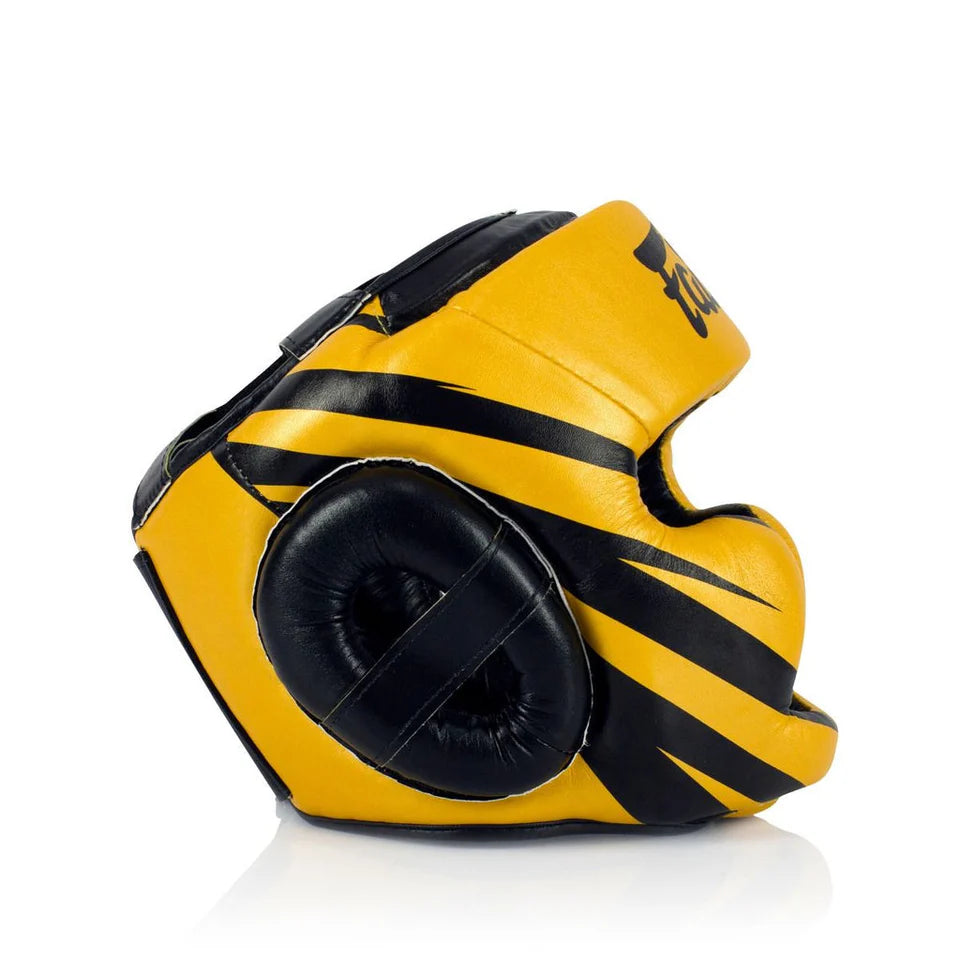 Yellow and black boxing headgear on a white background