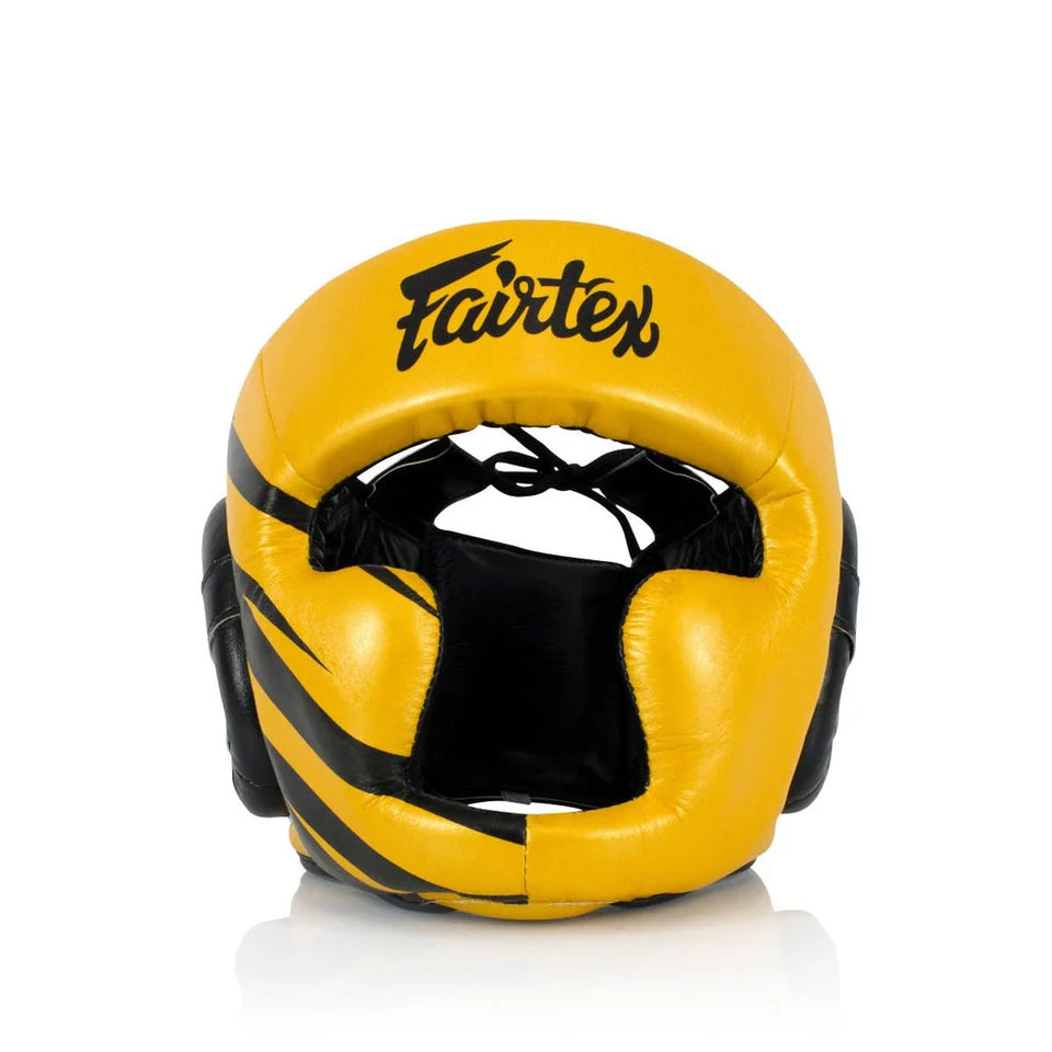 Yellow boxing headgear with black accents and Fairtex logo on a white background