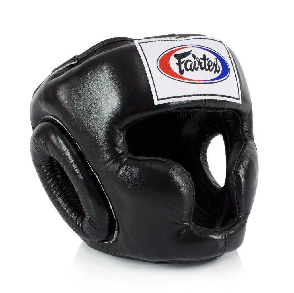 Black boxing headgear with a visible Fairtex logo on a white background