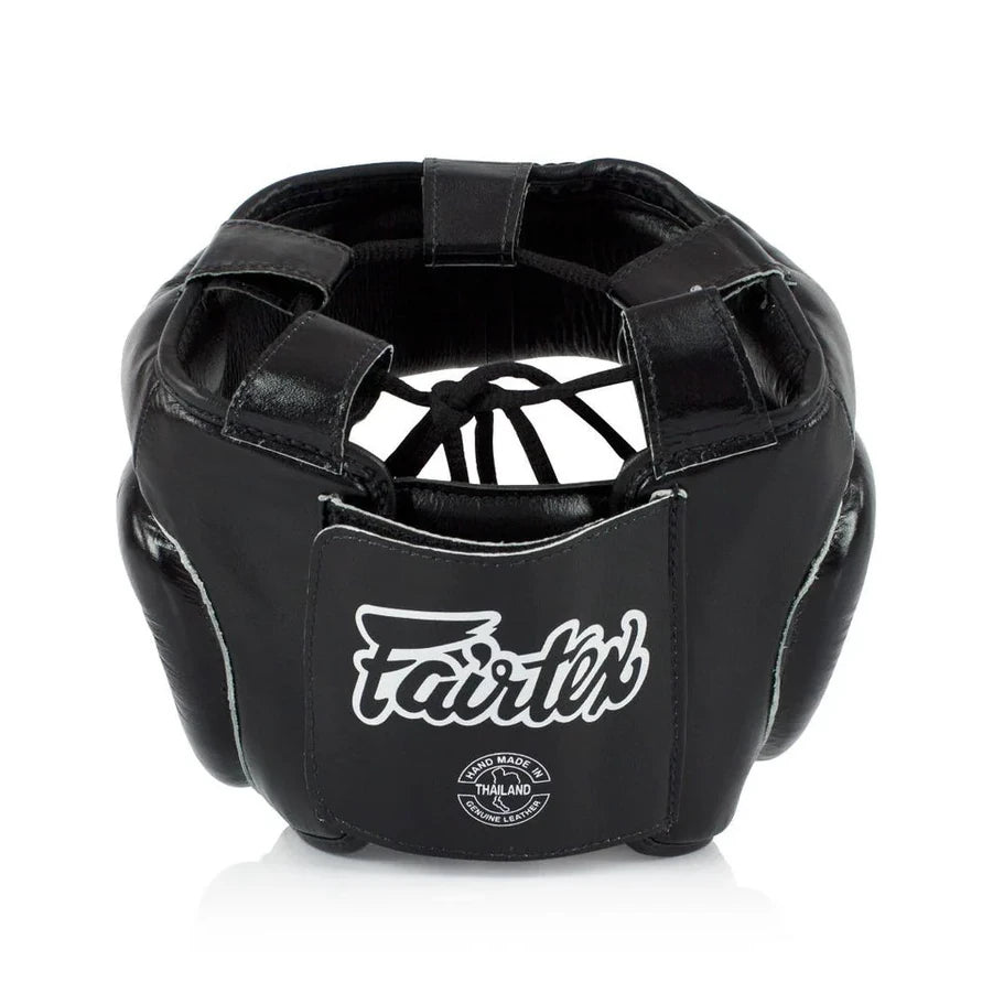Rear profile of a black boxing headgear with 'Fairtex' branding on a white background