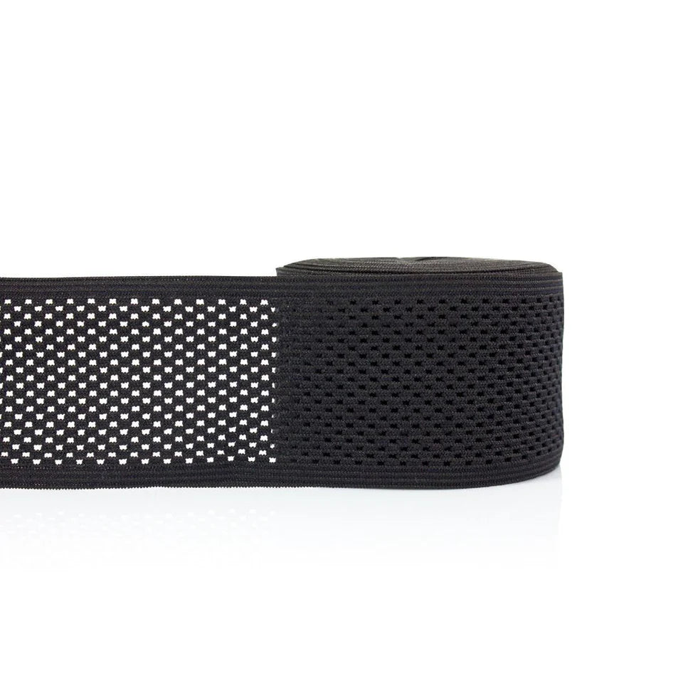 Black webbing strap with a pattern on a white background