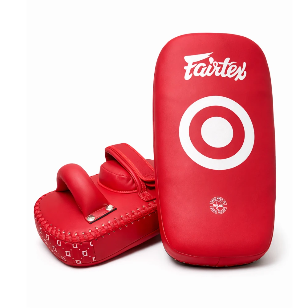 Red Fairtex Muay Thai pads with a white target design on a white background