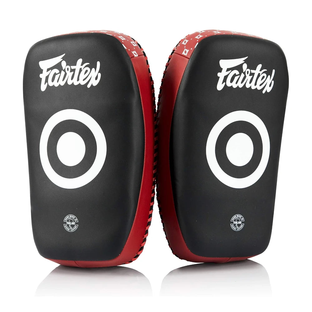 Pair of black and red Fairtex Muay Thai pads with white target design on a white background
