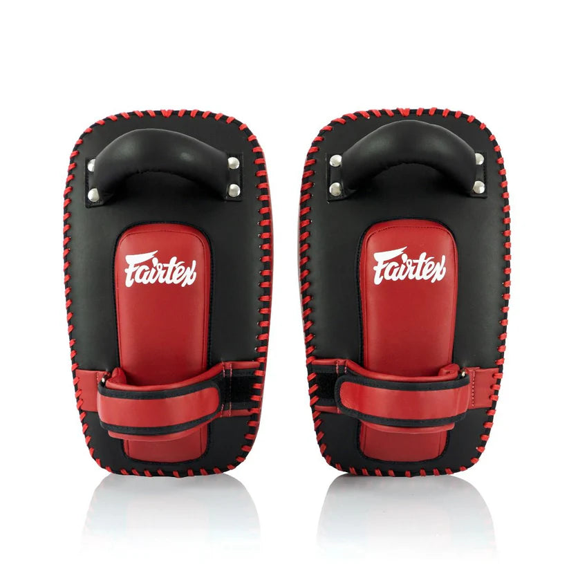 Pair of black and red Fairtex Muay Thai pads on a white background