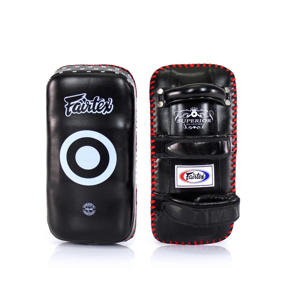 Pair of black and red Fairtex Muay Thai pads on a white background