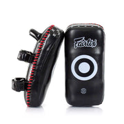 Black and red Fairtex Muay Thai pads on a white background