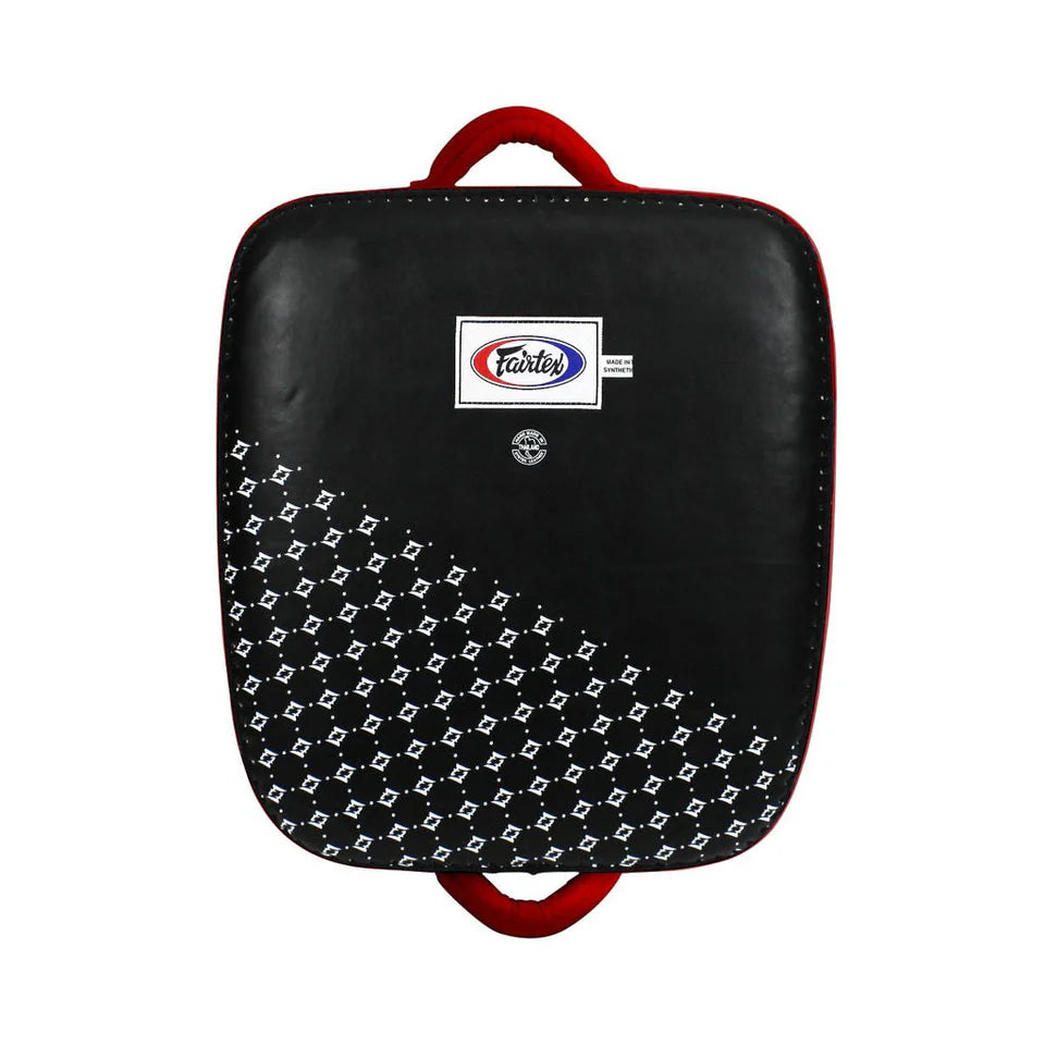 Black and red kick shield with Fairtex logo on a white background