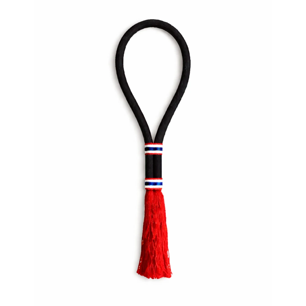 Black Muay Thai mongkon with a red tassel on a white background