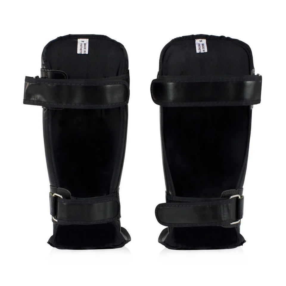 Pair of black shin guards on a white background
