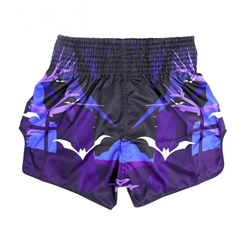 Purple and black Muay Thai shorts with white designs on a white background