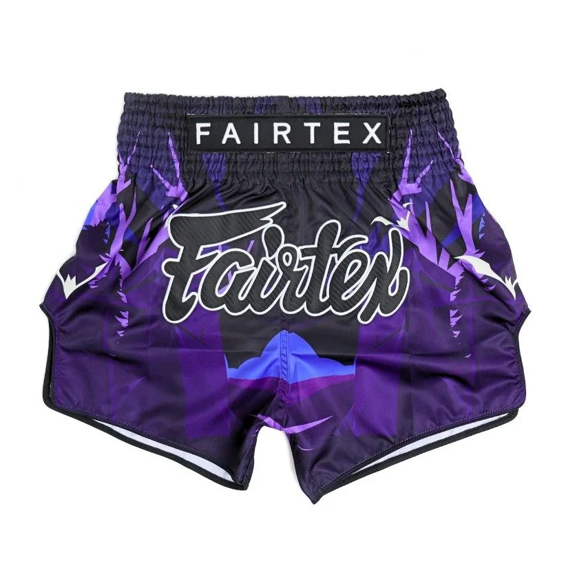 Purple and black Fairtex shorts on a white background