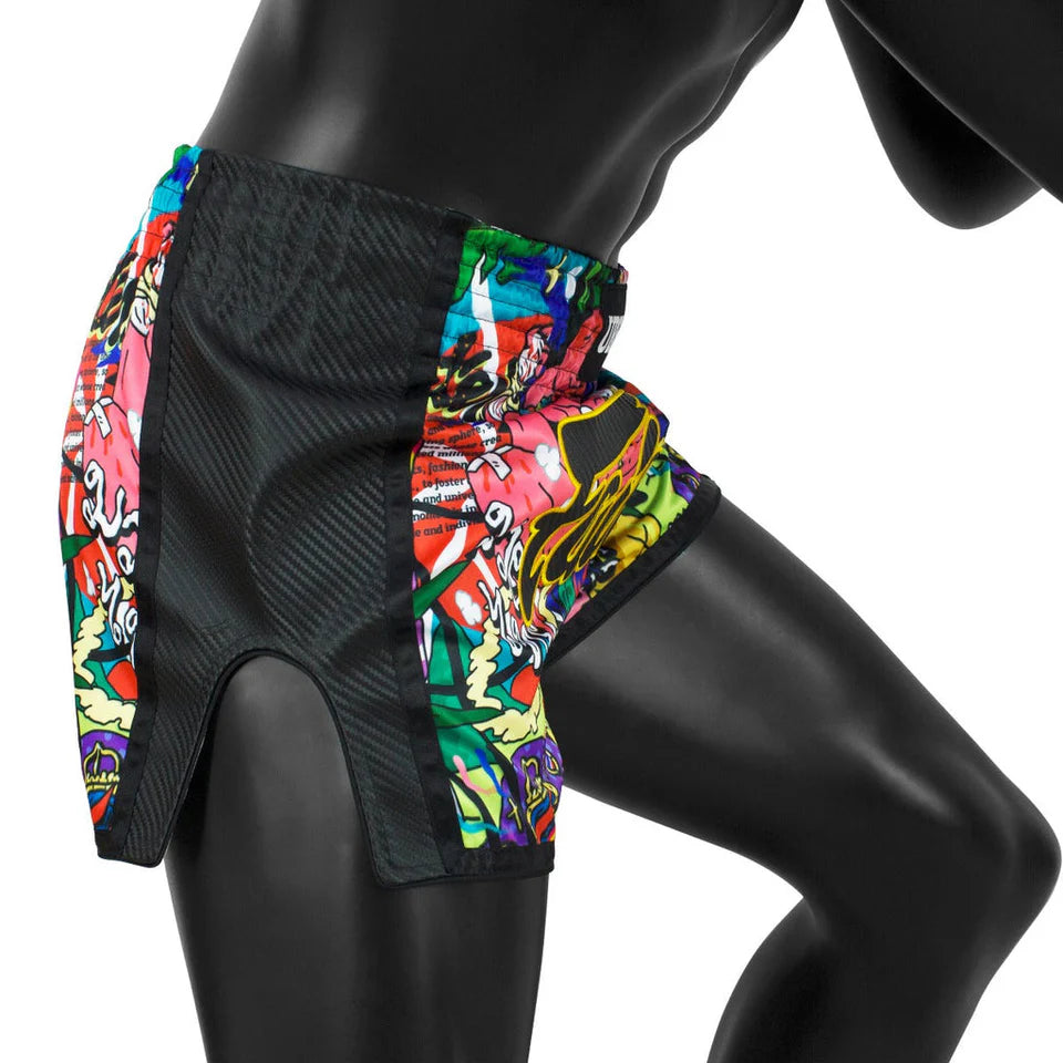 Colorful patterned Thai shorts on a black mannequin against a white background