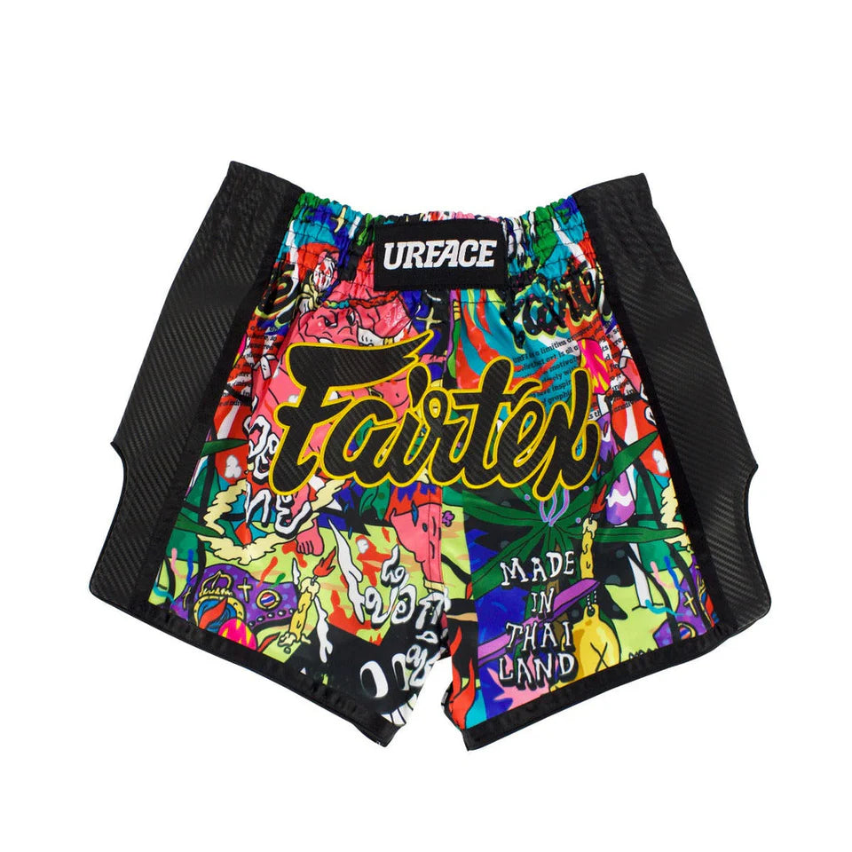 Colorful thai shorts with graphic design and 'Urface' branding on a white background
