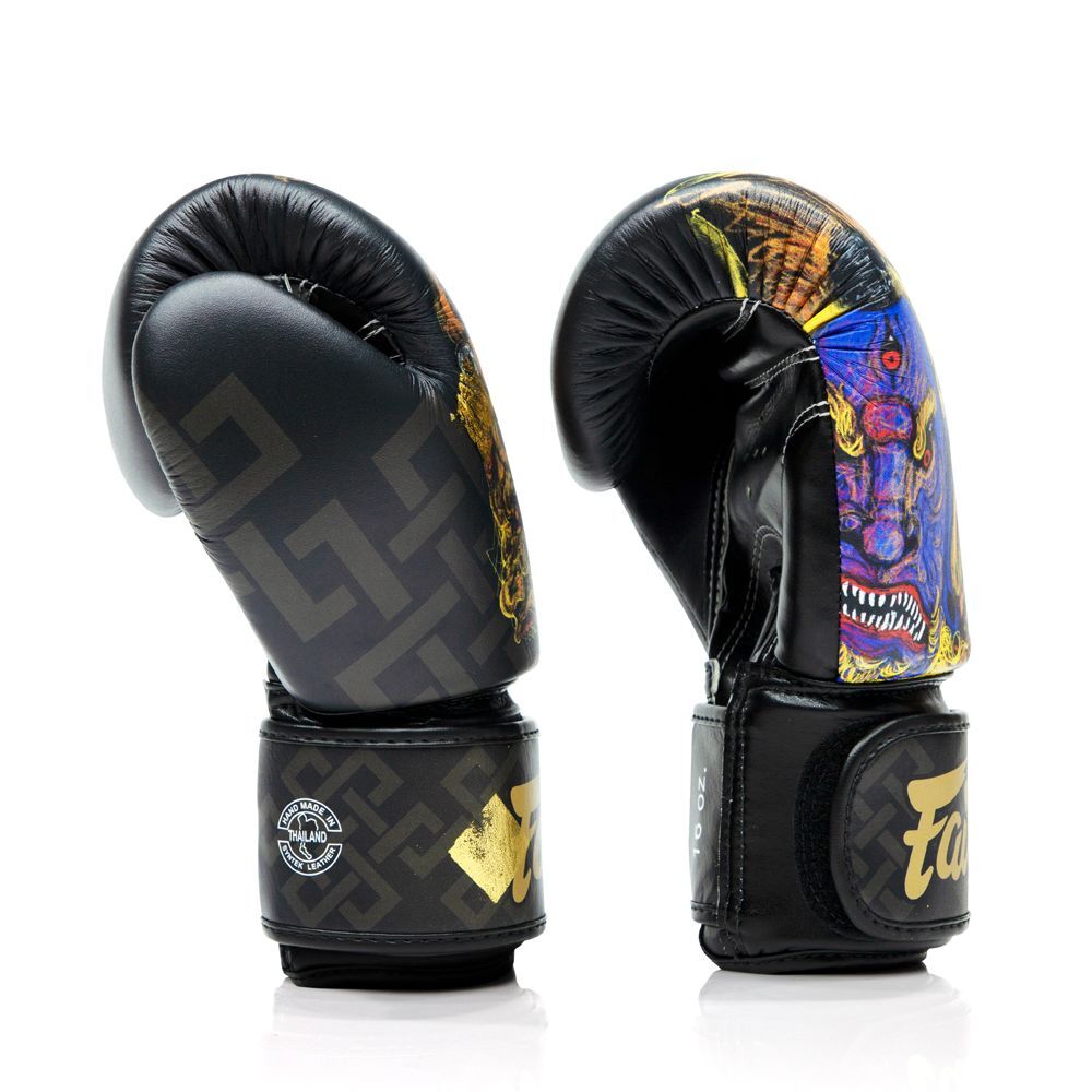 Side profile of a pair of black boxing gloves with colorful designs on a white background