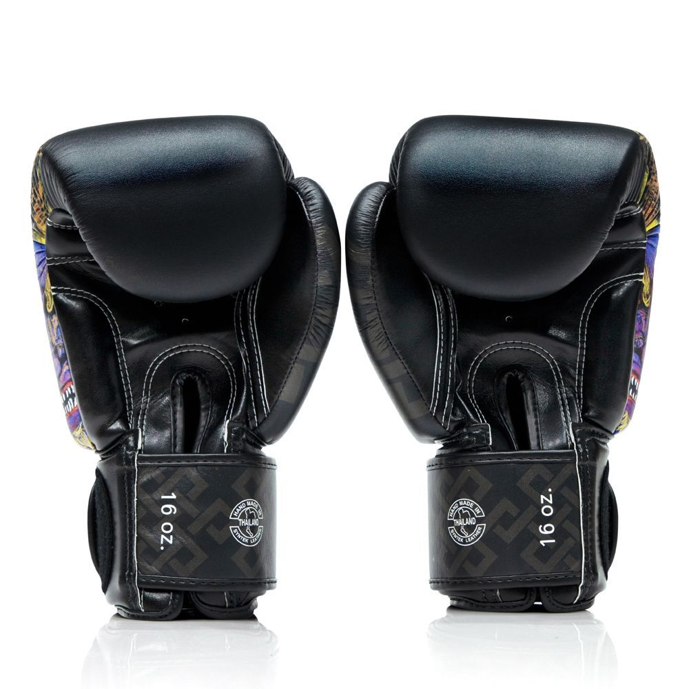 Pair of black Muay Thai boxing gloves with colorful patterns on a white background