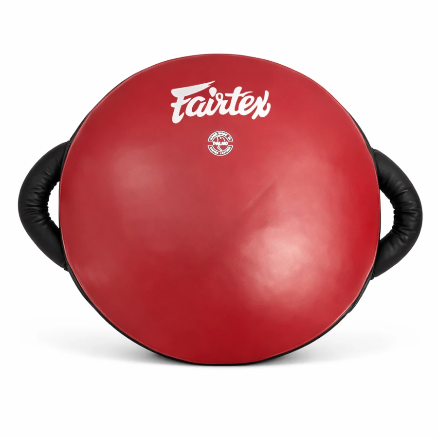 Red boxing round shield with black handles and Fairtex logo on a white background