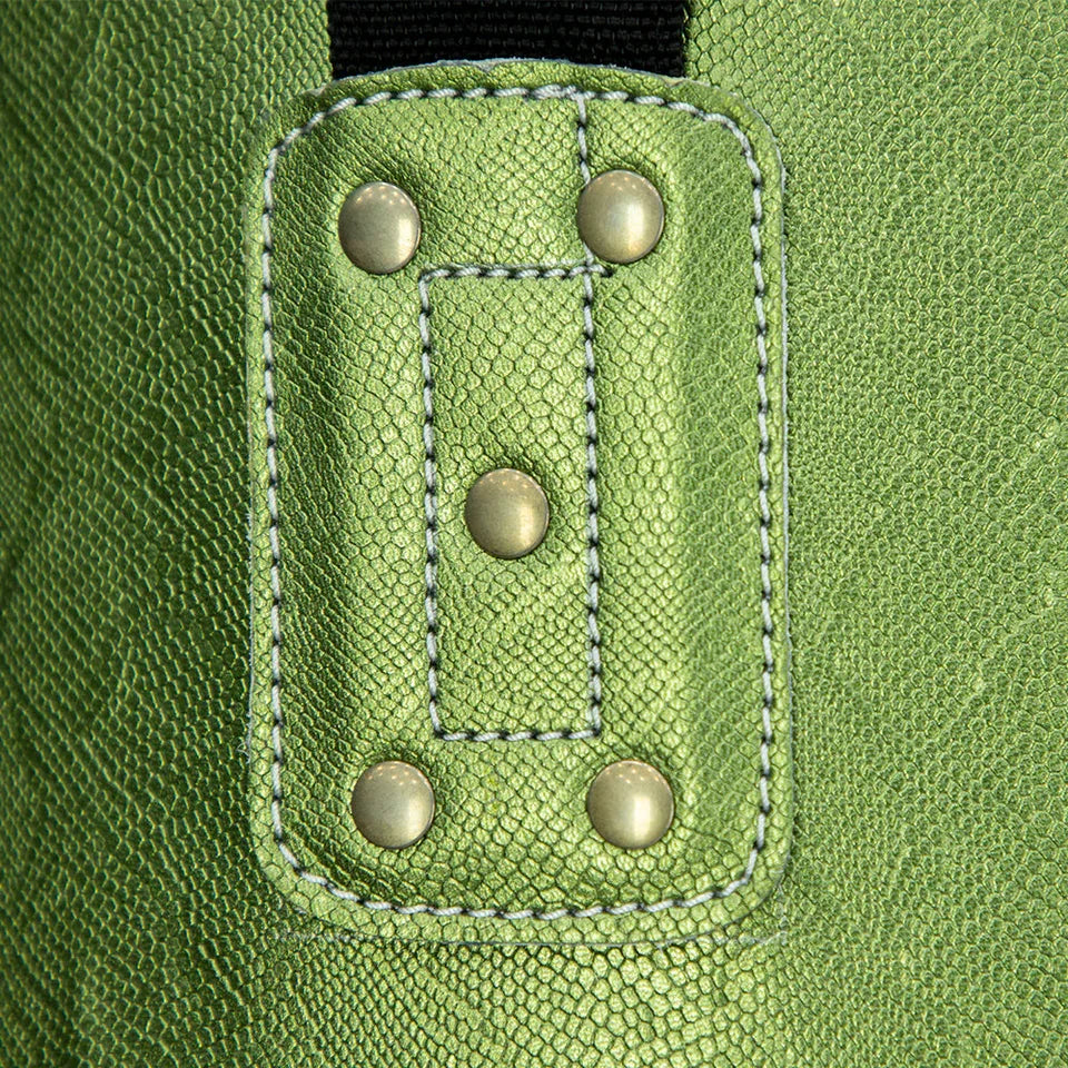 Close-up of a green boxing bag fabric and straps with buttonholes and buttons 