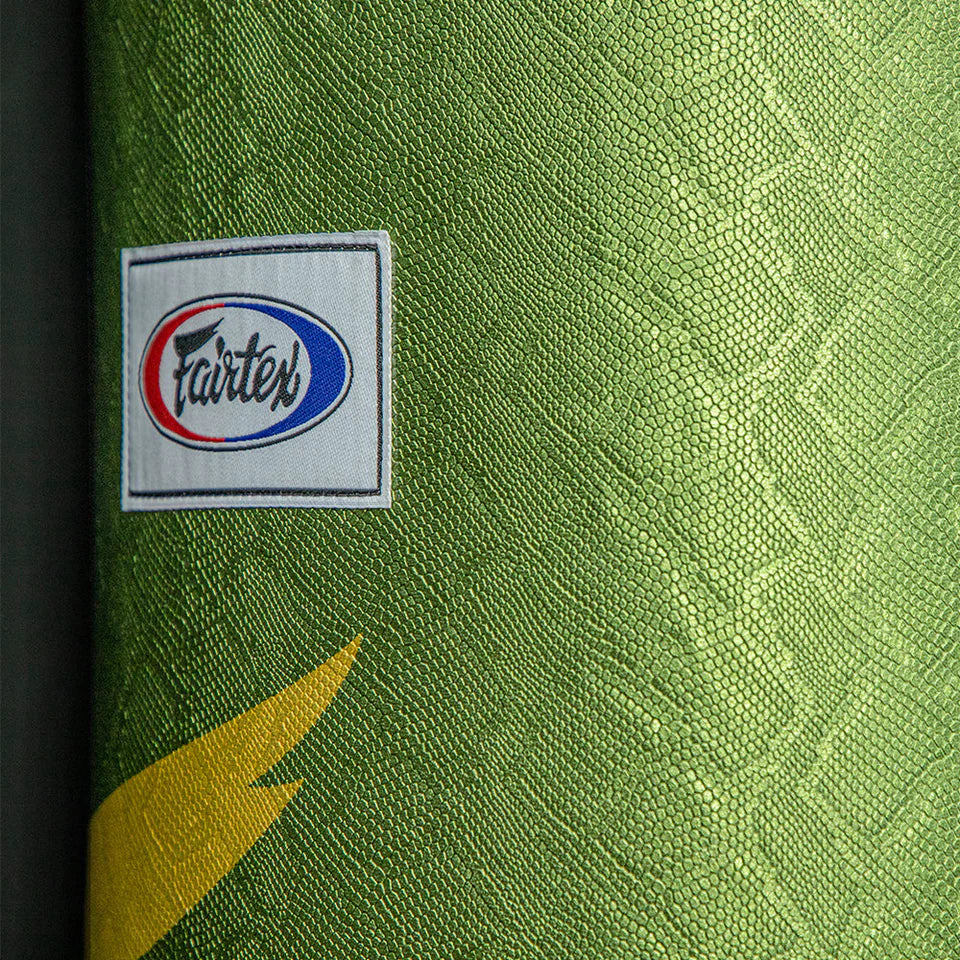 Green snake skin textured boxing bag with Fairtex logo and yellow F symbol.