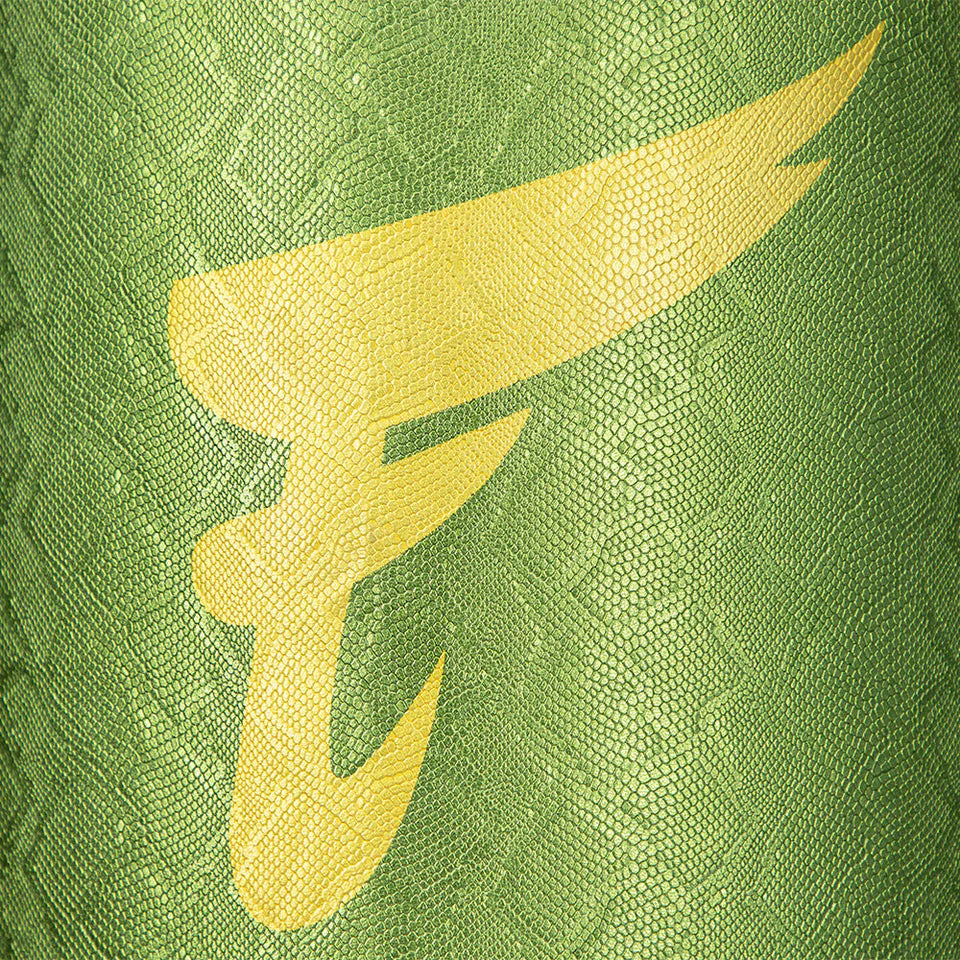 Close-up of a green textured boxing bag surface with a yellow F.