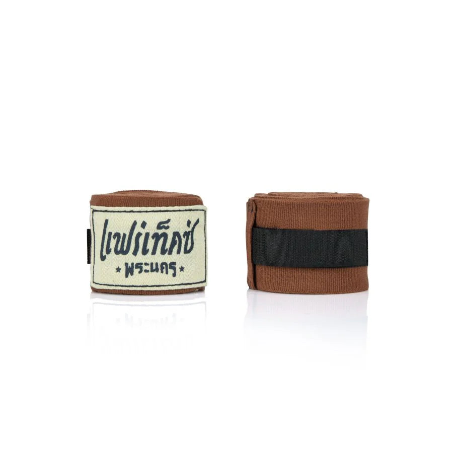 Brown boxing hand wraps with a brand label on a white background