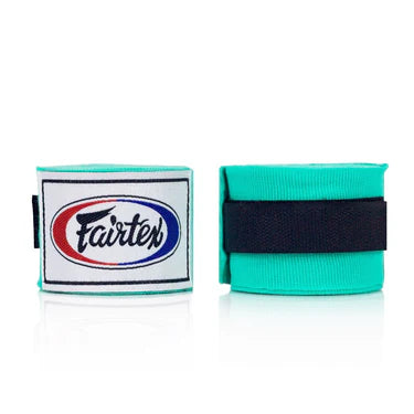 Two rolls of Fairtex boxing hand wraps, one green and one black, on a white background.