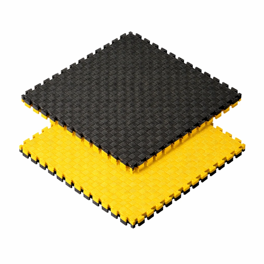 Black and yellow interlocking foam mats on a white background
