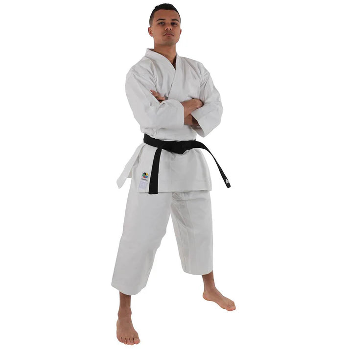 Male wearing a white martial arts uniform with a black belt on a white background