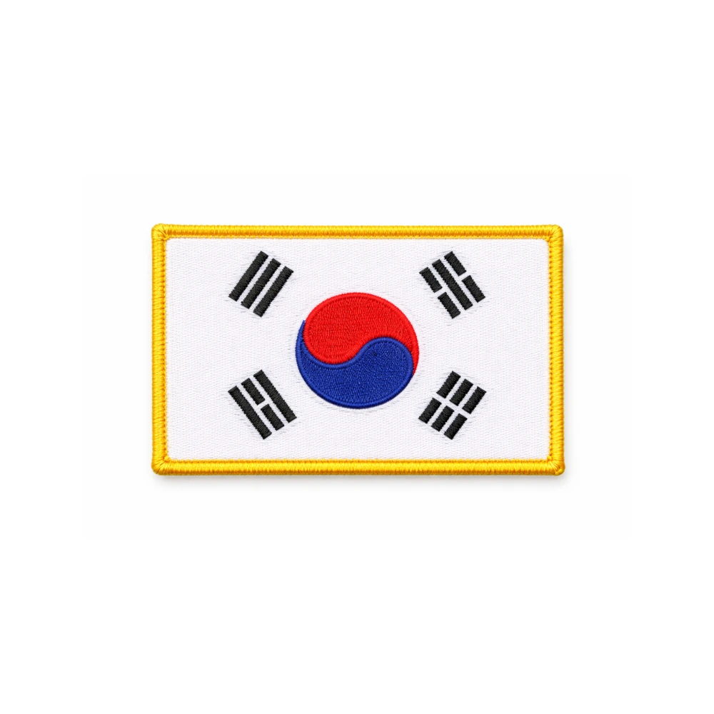 Embroidered patch of the South Korean flag on a white background