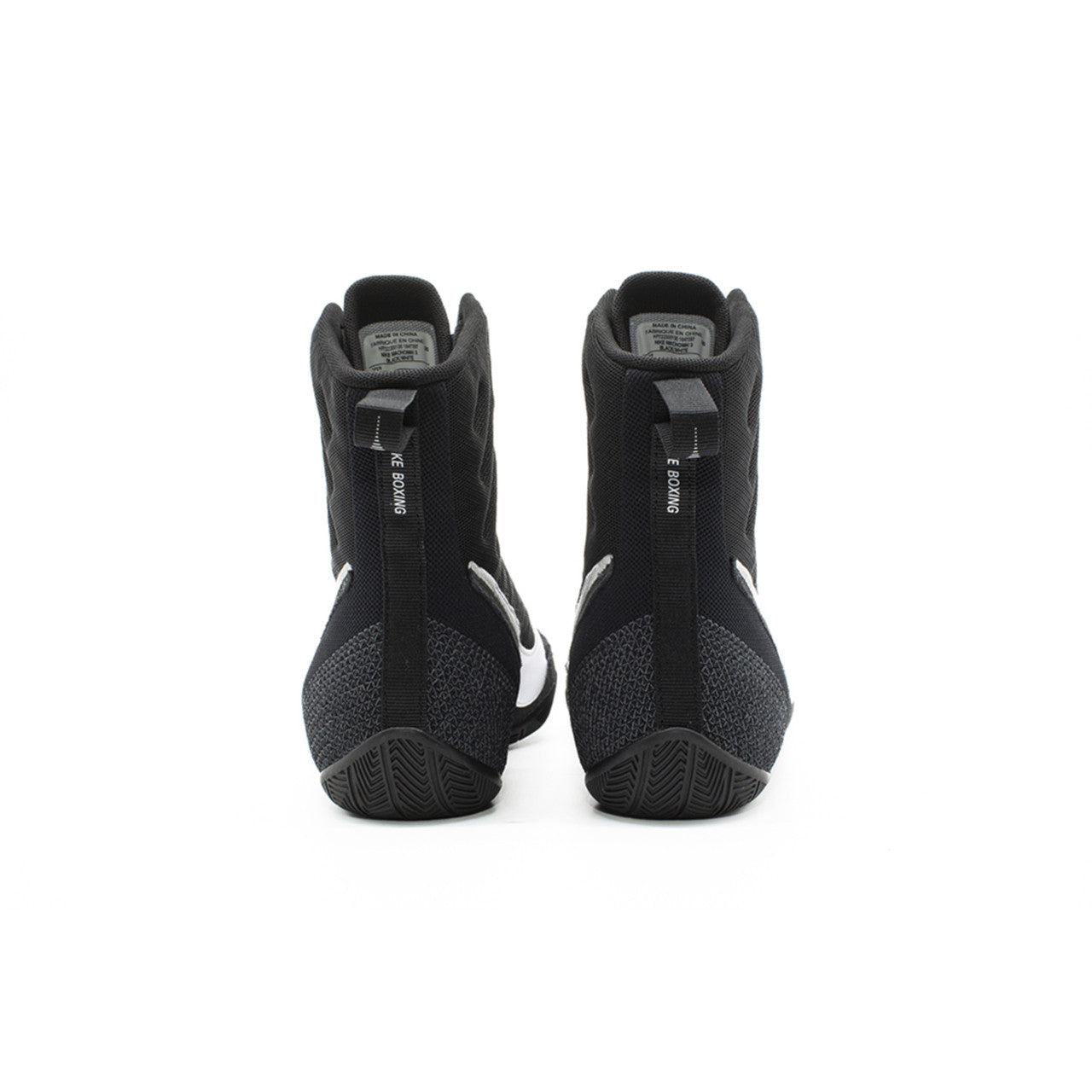Black high-top boxing shoes with white accents on a white background