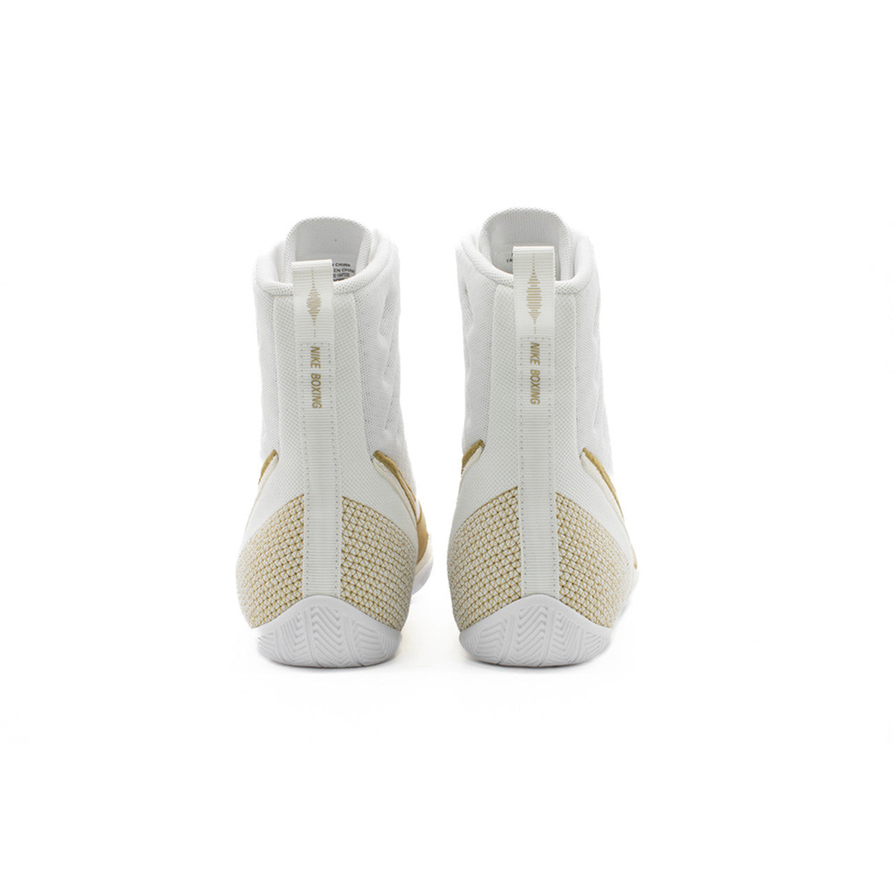 A pair of white high-top Nike boxing shoes shown from the back, featuring textured white uppers, beige mesh panels on the heel, and gold 'JUST DO IT' text on the heel collar.