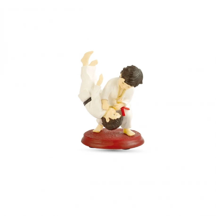 Figurine of two martial artists in a sparring pose on a white background