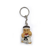 Keychain with a cartoon character in a martial arts pose on a white background