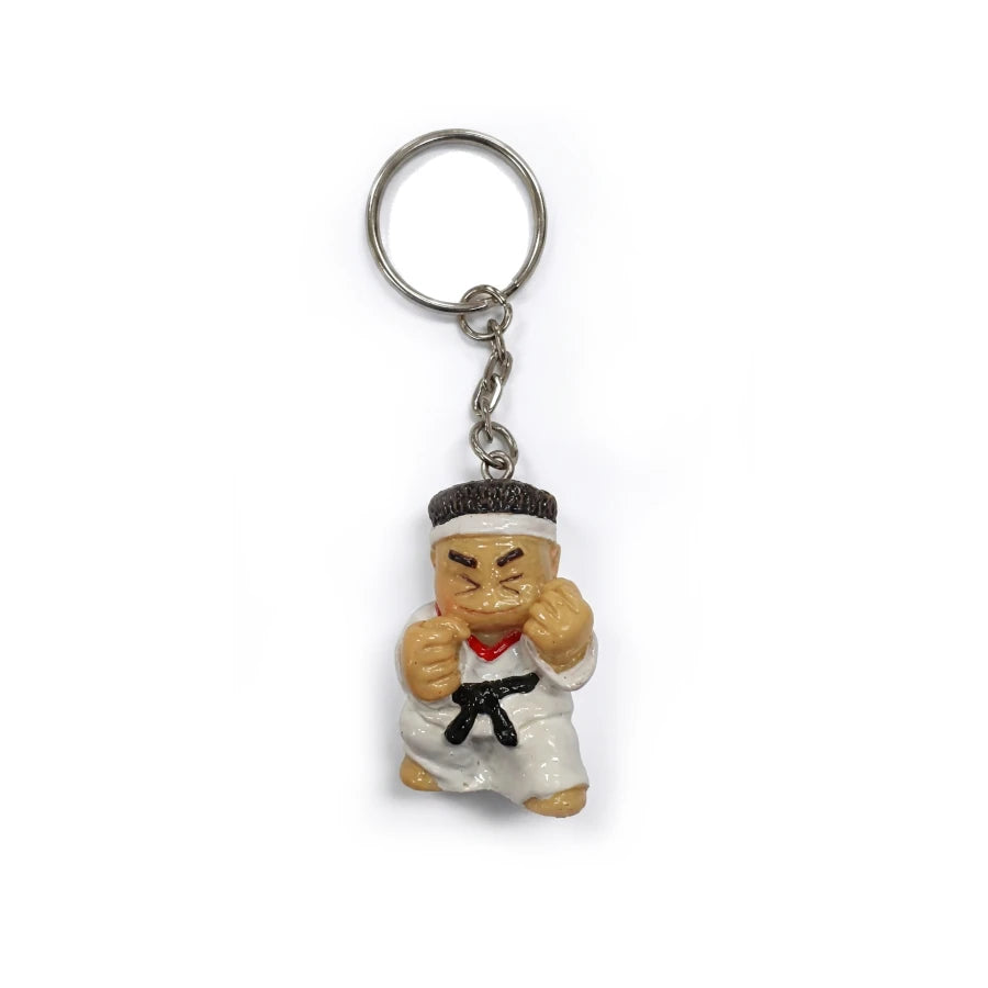 Keychain with a cartoon character in a martial arts pose on a white background