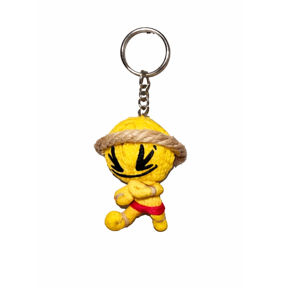 Yellow plush muay thai keychain with a keyring on a white background