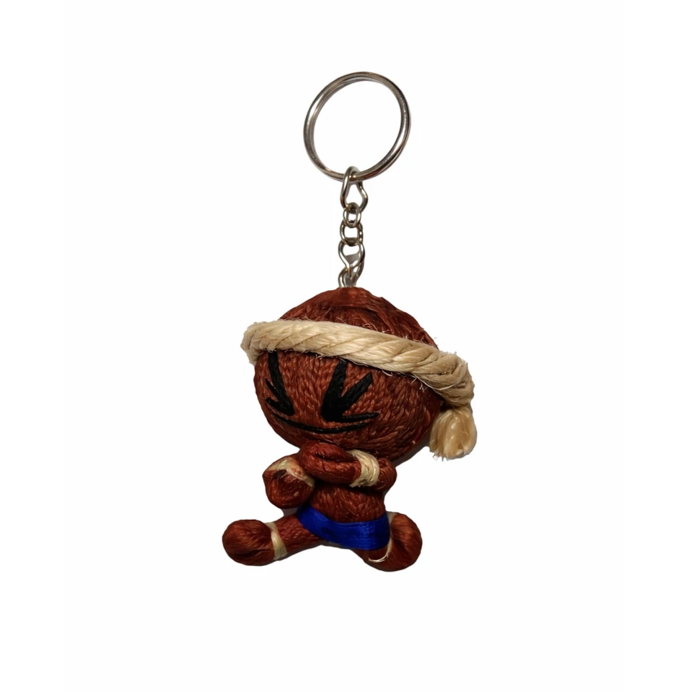 Brown plush muay thai keychain with a keyring on a white background