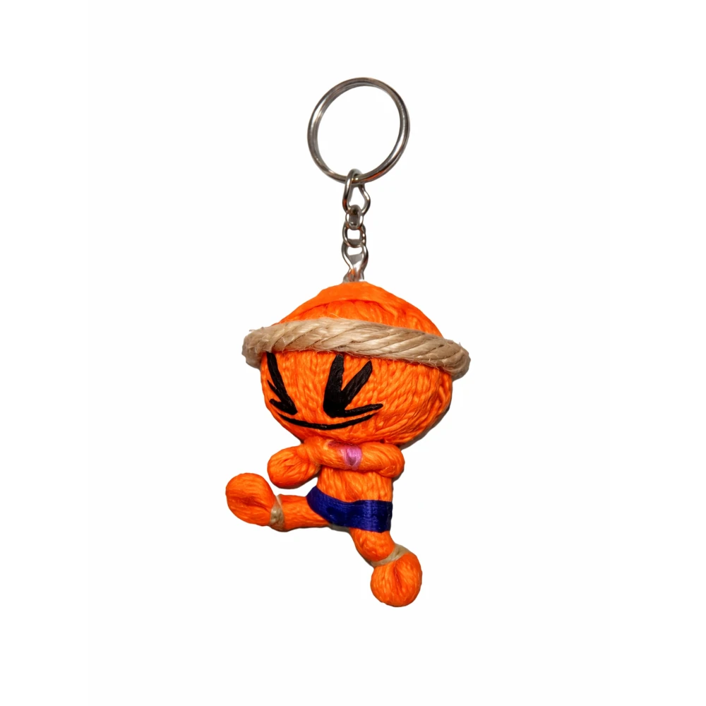 Orange plush muay thai keychain with a keyring on a white background