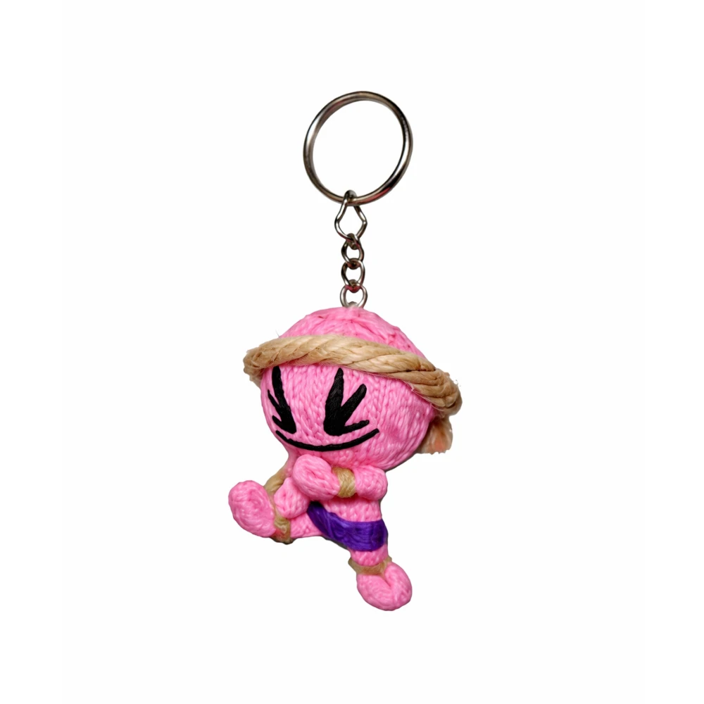 Light pink plush muay thai keychain with a keyring on a white background