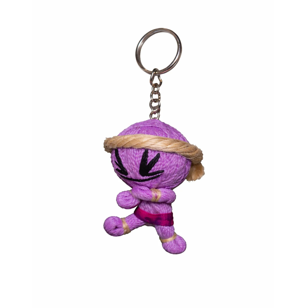 Purple plush muay thai keychain with a keyring on a white background