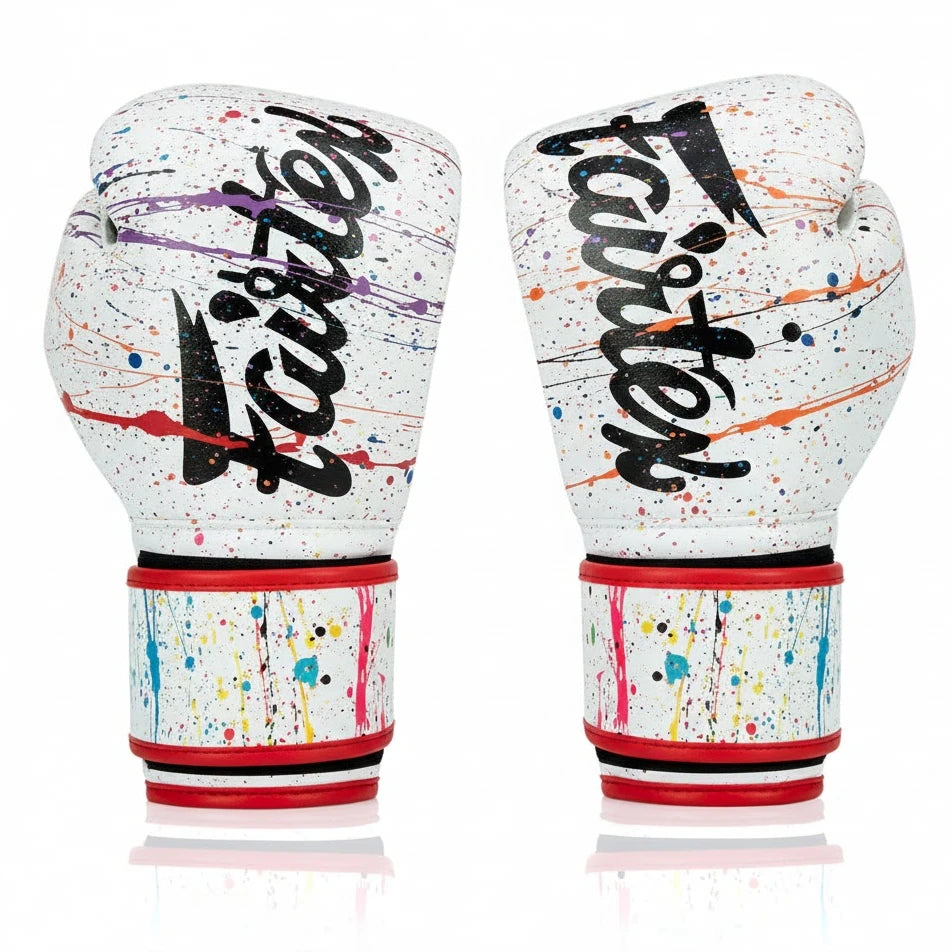 Pair of colorful boxing gloves with 'Fairtex' branding on a white background