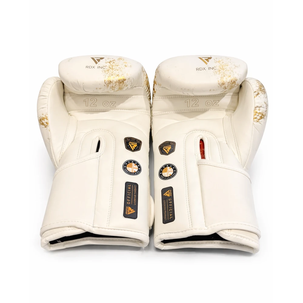 Pair of white boxing gloves with gold accents on a white background