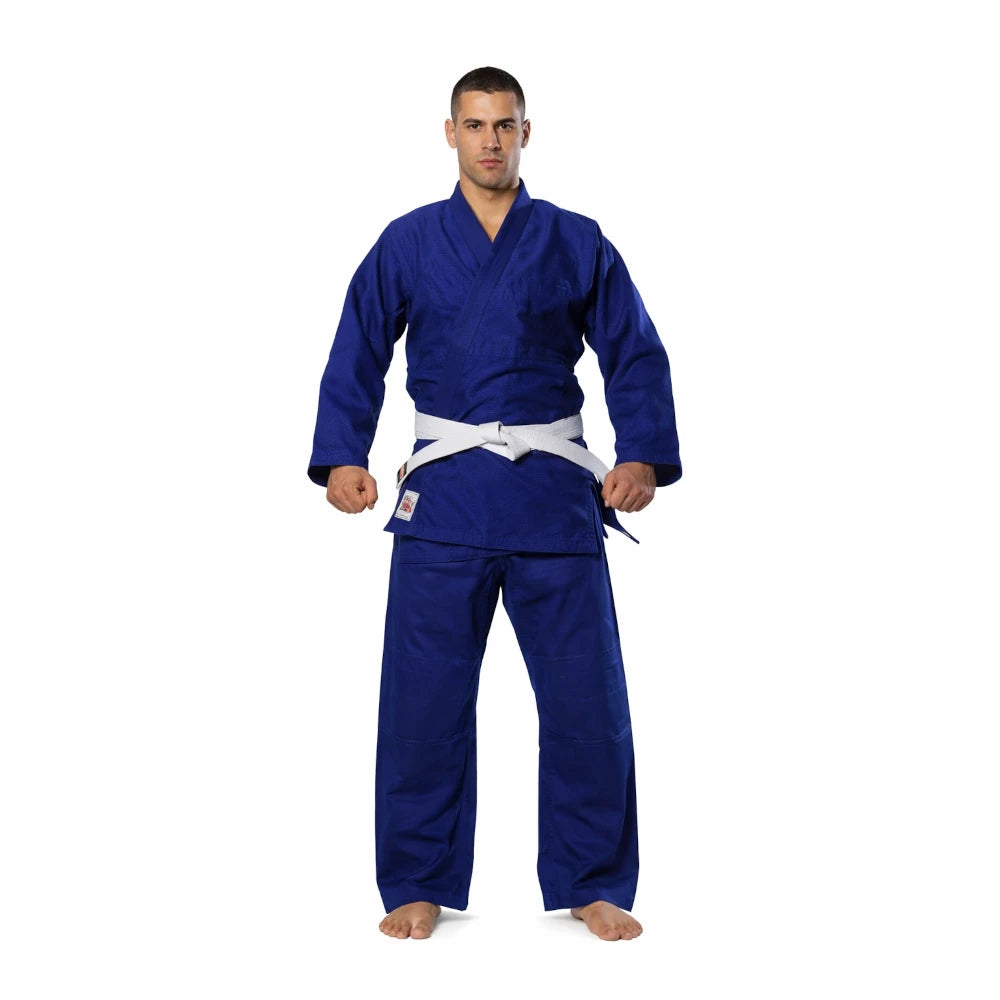 Man wearing a blue martial arts uniform on a white background