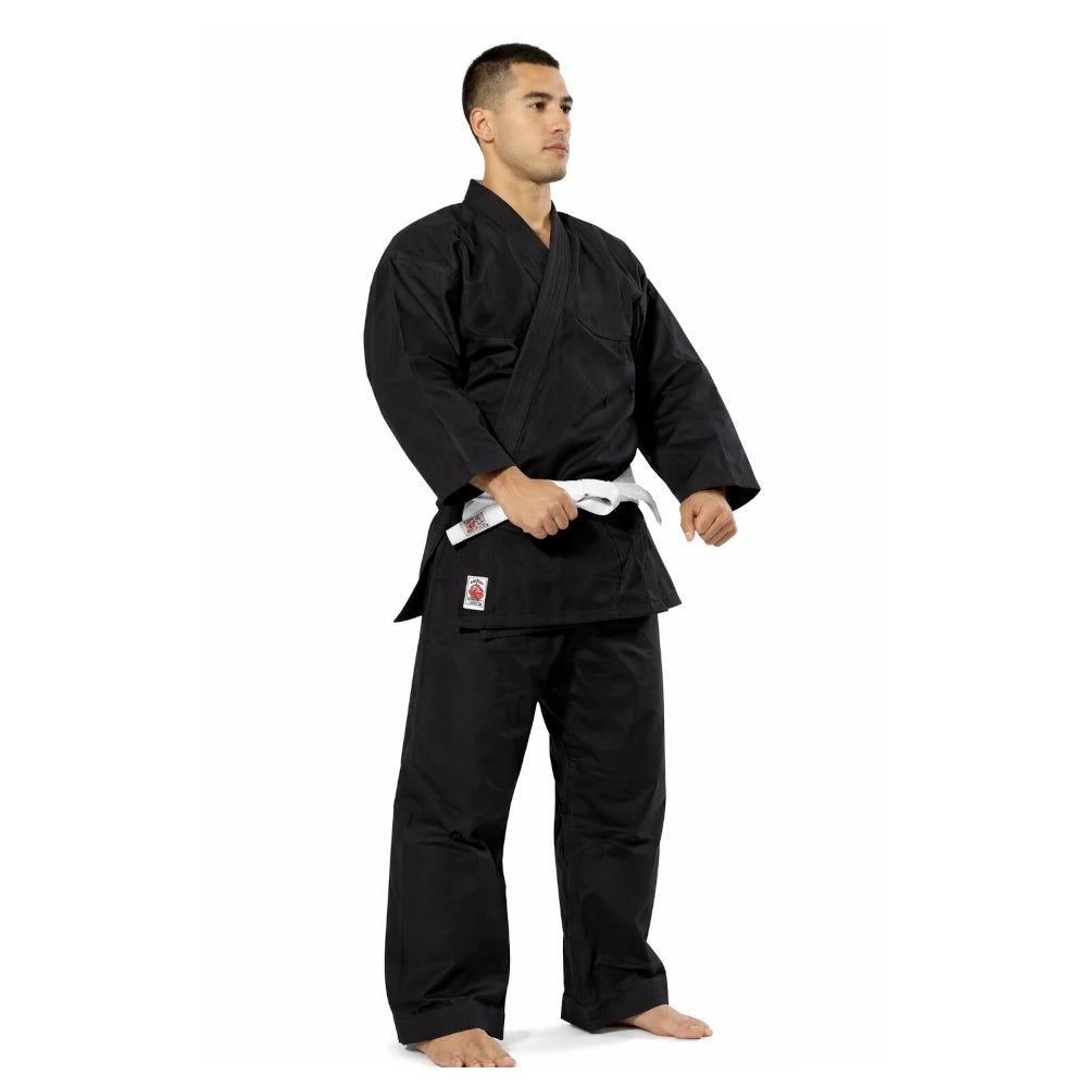 Man wearing a black martial arts uniform with a white belt on a white background