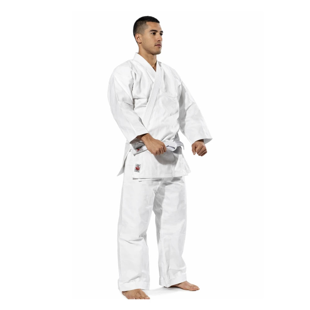 Man wearing a white martial arts uniform on a white background