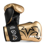Pair of gold and black boxing gloves with 'Rival' branding on a white background