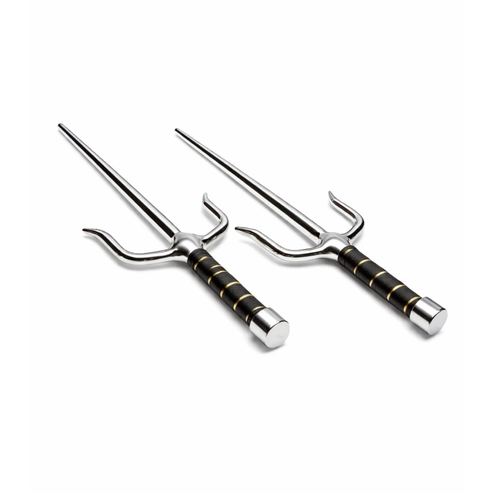 Two metal sai training weapons with black and gold handles on a white background