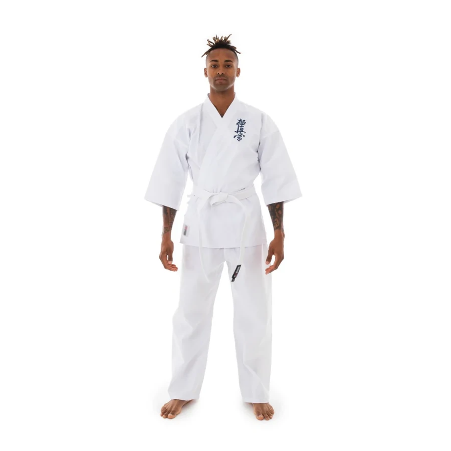 Person wearing a white SMAI martial arts uniform on a white background